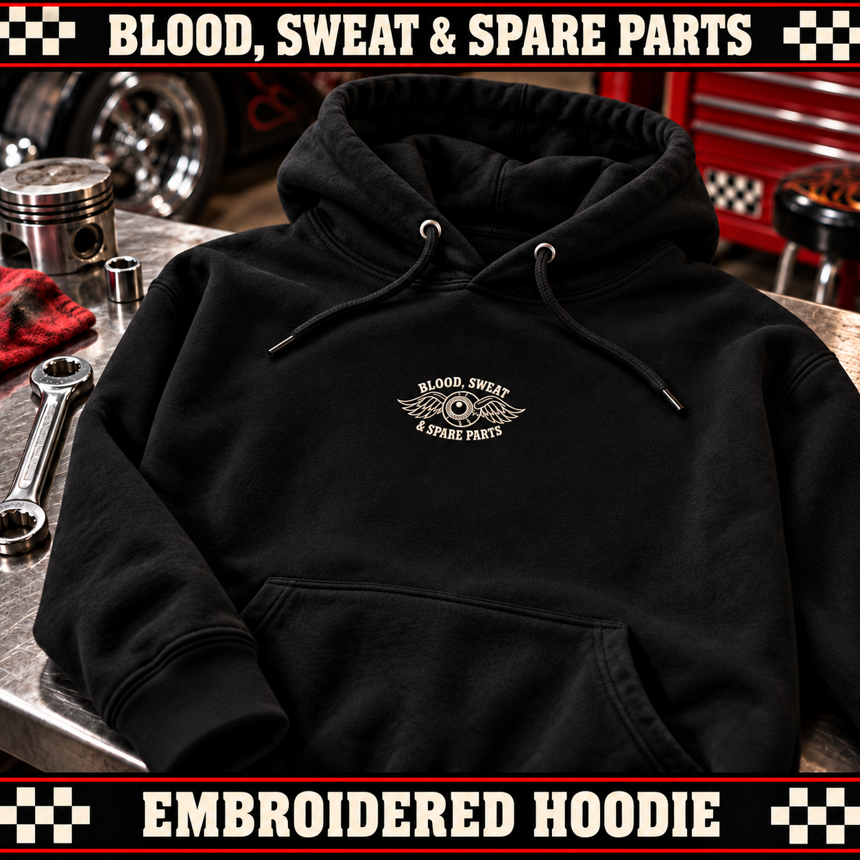 Black hoodie with small winged-eyeball embroidery within a six-inch maximum