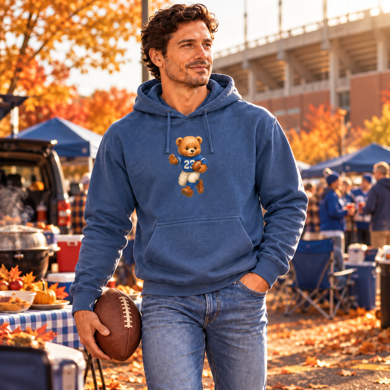 Man wearing denim-blue Football Bear Hoodie at fall tailgate