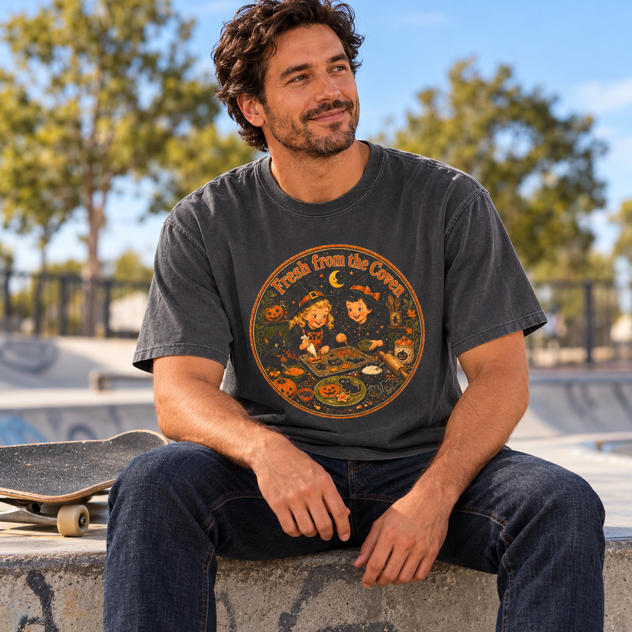 Fresh from the Coven charcoal tee — man relaxing at a skatepark