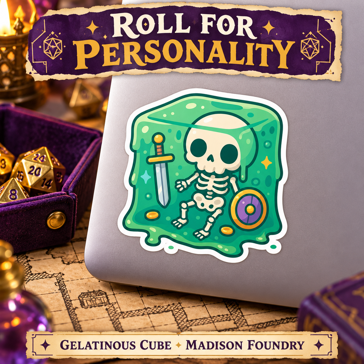 Gelatinous cube vinyl sticker on a silver laptop at a tabletop gaming desk with purple dice tray and parchment map.