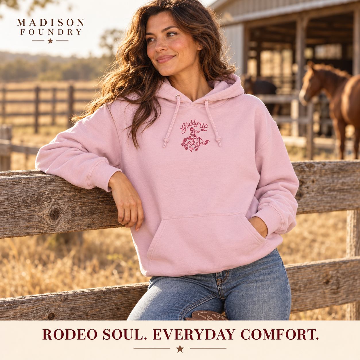 Giddy Up embroidered pink hoodie at a Texas ranch