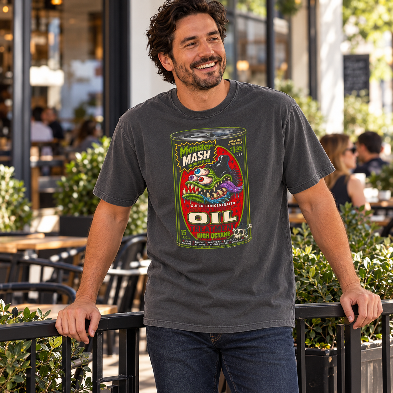 Monster Mash Oil Treatment tee — man laughing on a cafe patio