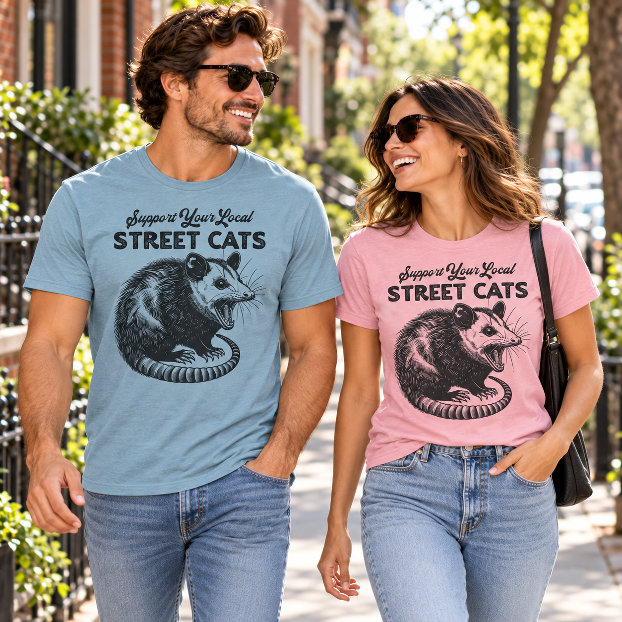 Man and woman wearing Support Your Local Street Cats tri-blend tees