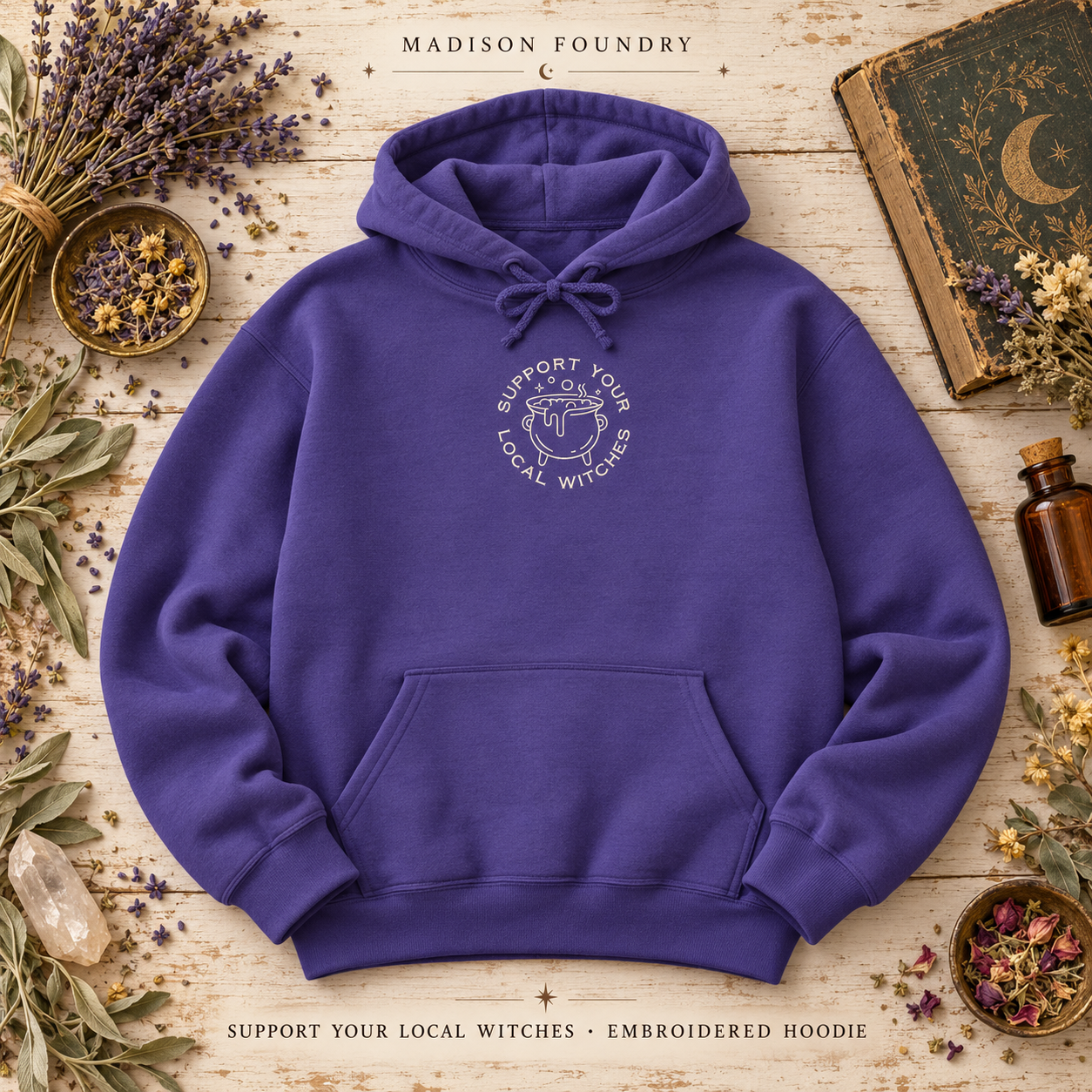 Purple Support Your Local Witches embroidered hoodie with small centered chest design