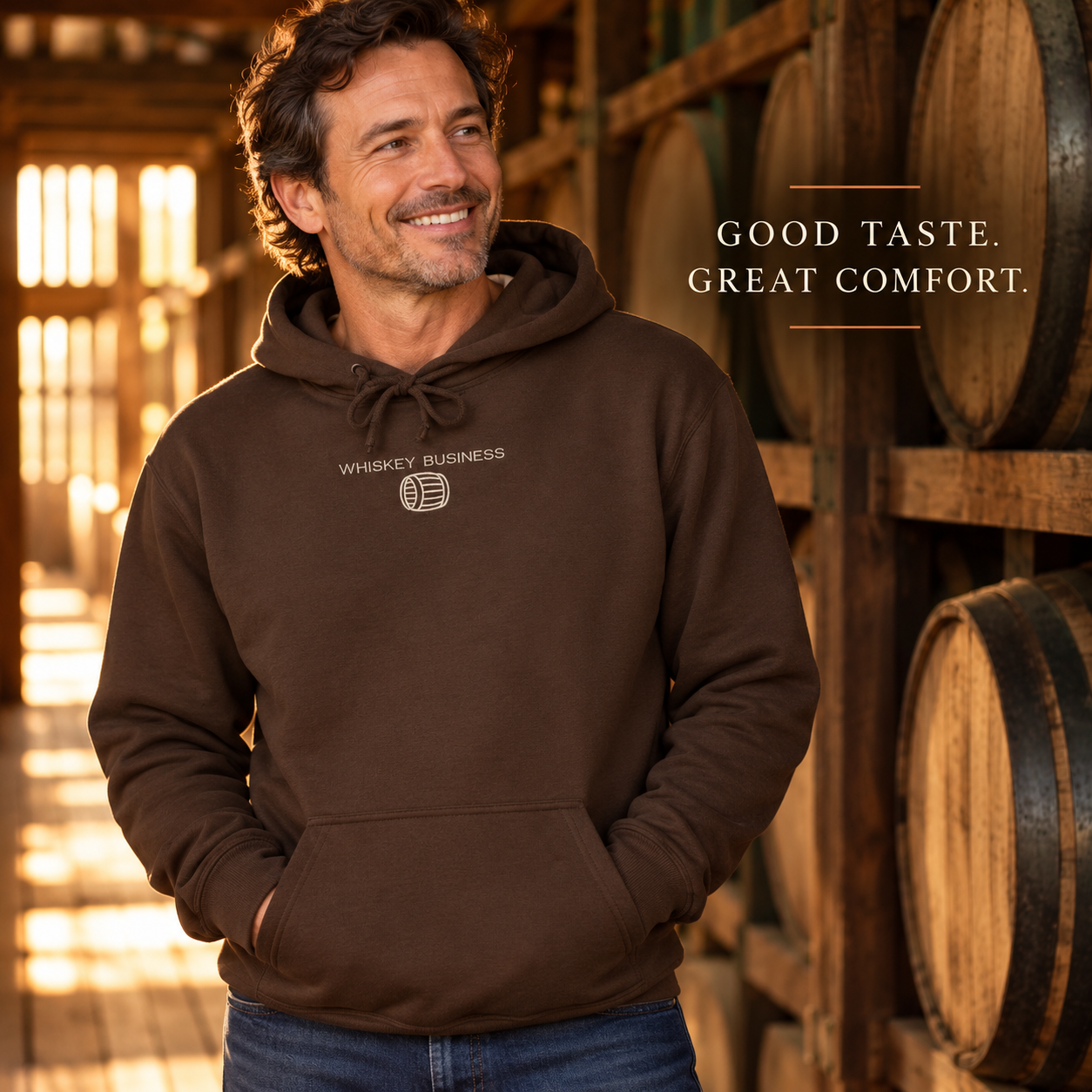 Whiskey Business Chocolate embroidered hoodie worn in a bourbon rickhouse